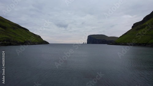 Flight from black beach of Tjornuvik over Atlantic waters heading to Risin og Kellingin photo