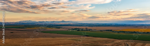 Stunning aerial panorama of beautiful autumn fields   and colorful sunset sky