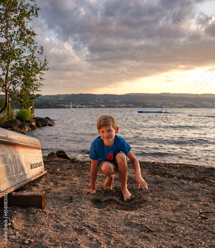 child sitting on the beach