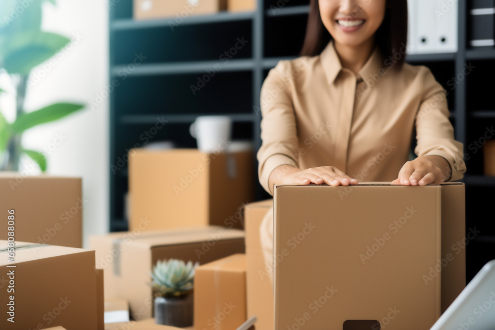 Closeup hand of business woman owner happy with shipping package at home office packaging box on background.ecommerce logistics,Online sale. Closeup hand of business woman owner happy with shipping package at home office packaging box on background.ecommerce logistics,Online sale.