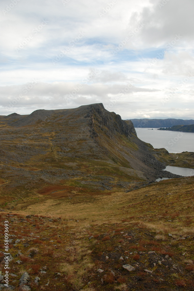A cliff over Duksfjorden on Mageroya Island, Norway A cliff over Duksfjorden on Mageroya Island, Norway