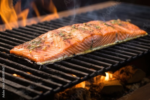 salmon on a cedar plank on a barbecue cast iron grid