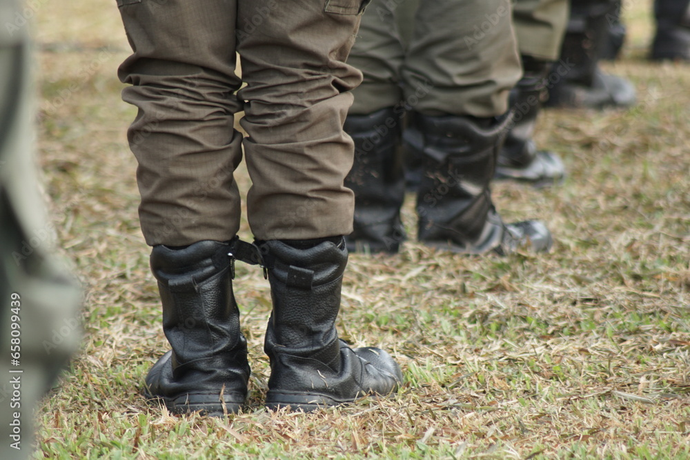 The cadets in black boots lined up neatly at the flag raising ceremony