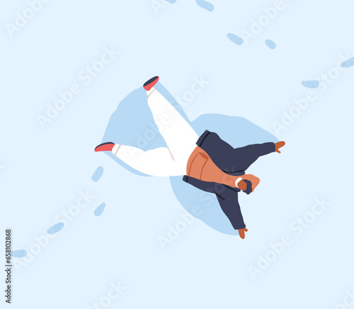 Black man making snow angel, wings prints, lying in snowdrift. Winter holiday...