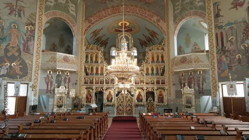 Inside an empty Greek Catholic cathedral. Large church chandelier.