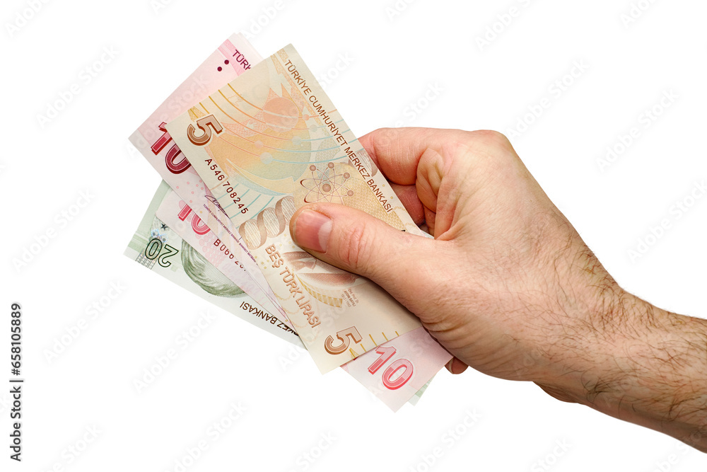 A hand holding, giving or paying Turkish Lira in 5, 10 and 20 banknotes, paper currency, isolated against a transparent background.