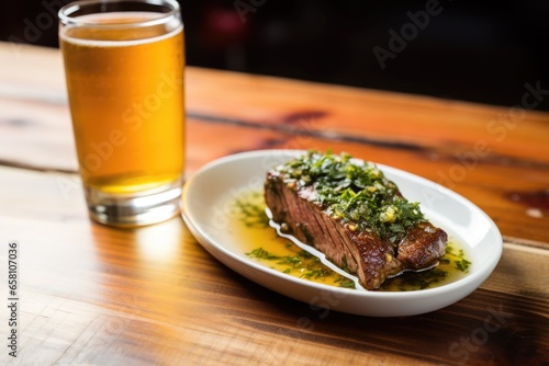 steak marinated in tangy herbs, served with a large glass of saison