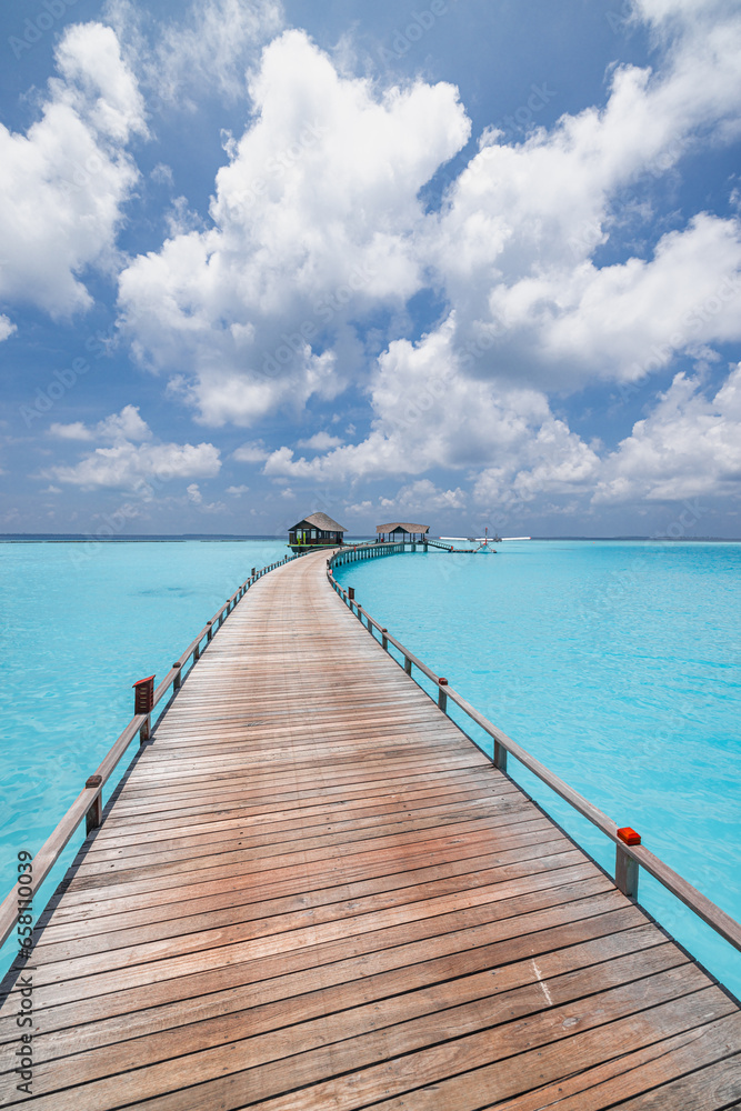 Panoramic landscape of Maldives beach. Tropical resort luxury water villa resort wooden pier. Popular travel destination background for summer holiday best vacation. Exotic sea bay sunny sky clouds