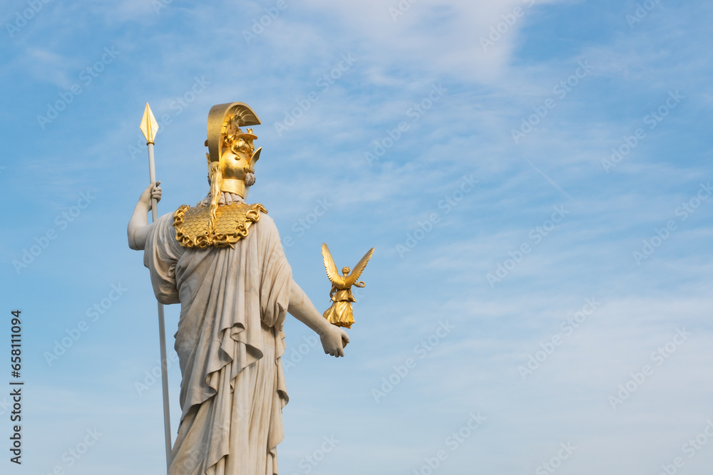 Fototapeta premium Pallas Athene statue in front of the Austrian houses of Parliament in Vienna, Austria, Europe.
