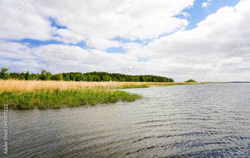 View of Lake Zalew Kamienski. Landscape at the lagoon of the Dziwna, which flows into the Baltic Sea. Nature in the Polish West Pomeranian Voivodeship. photo