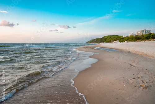 Fototapeta Naklejka Na Ścianę i Meble -  Beach near Misdroy in Poland. Natural coastal section on the Polish Baltic Sea. Landscape by the sea with wide sandy beaches.
