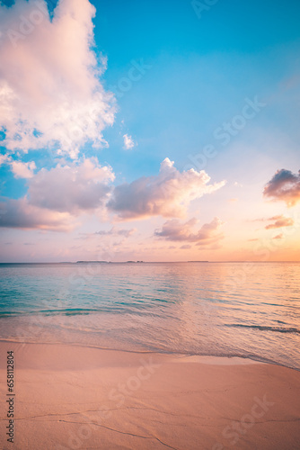 Closeup sea waves sand beach. Panoramic beach landscape. Inspire tropical coast seascape horizon. Stunning sunset sunlight colors, tranquil peaceful sky calm water. Happy positive vacation travel mood