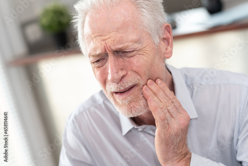 Senior man suffering from toothache