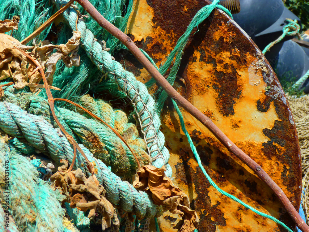 colorful ropes on the rusty ship's surface