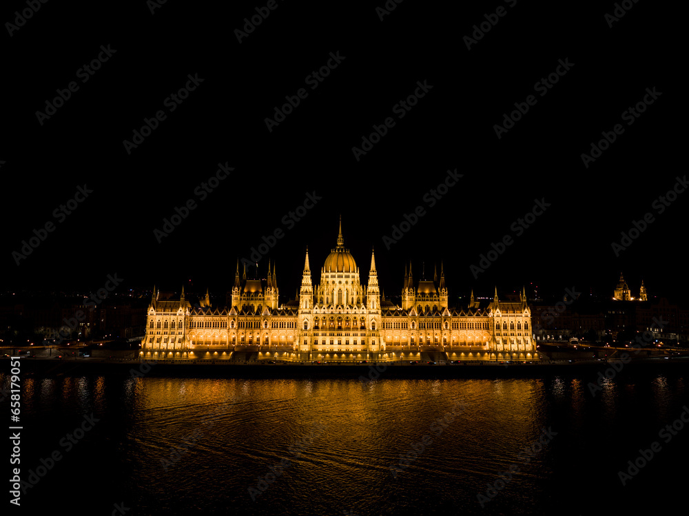 Landscape of the Hungarian Parliement Building at night in Budapest Hungary on the side of the Danube