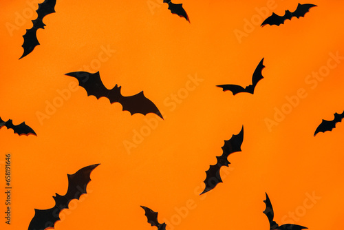 Halloween Background: Flying Bats on Orange
