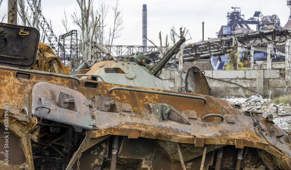 burnt tank and destroyed buildings of the Azovstal plant shop in Mariupol burnt tank and destroyed buildings of the Azovstal plant shop in Mariupol