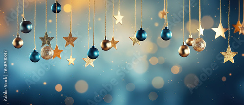hanging golden start ornaments with bokeh light blue  New Year photo