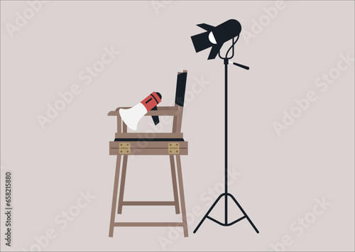 A behind-the-scenes scenario featuring movie equipment: a softbox lighting, a megaphone, and a director's chair