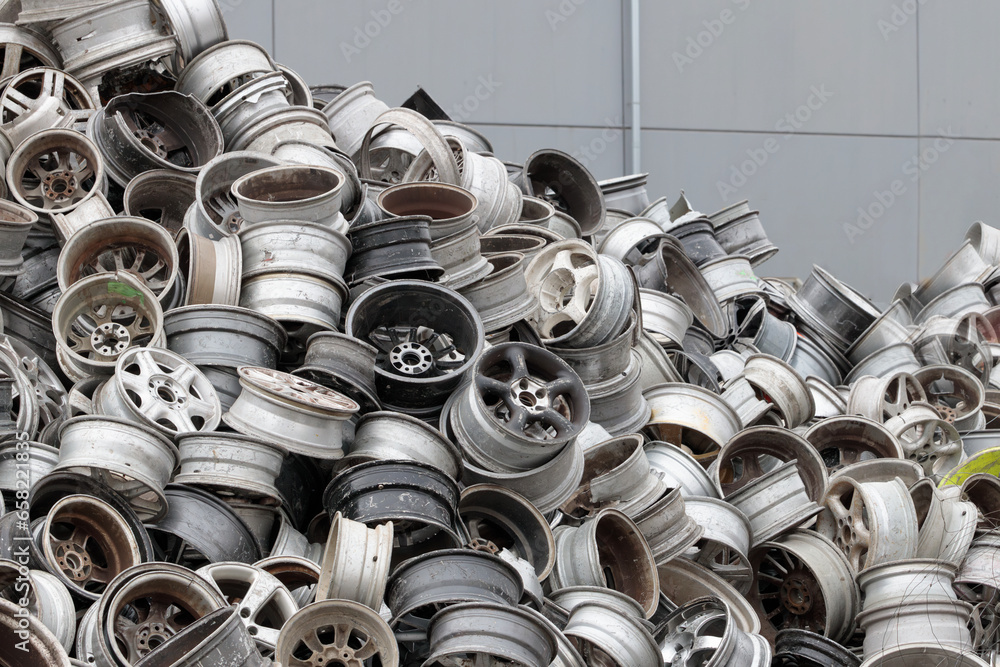 Scrapyard Closeup Aluminum Rims for Recycling. Pile of old car rims at
