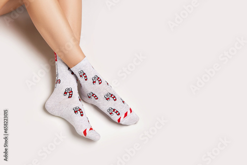 Woman legs in christmas socks