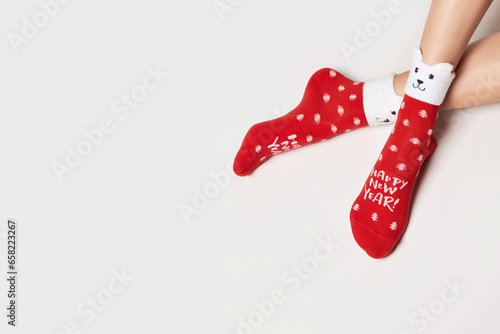 Woman legs in christmas socks