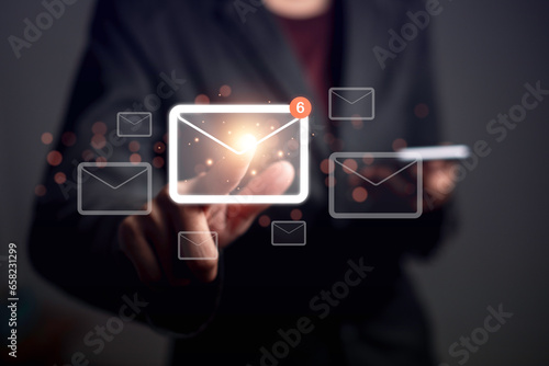 Email notification alert or Send Mail newsletter concept. Business man use smartphone checking digital letter inbox and touch email icon. Scheme of direct sales in target customers.