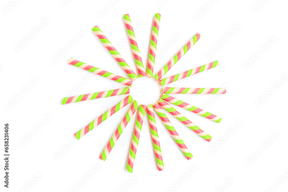 Colorful striped wafer stick rolls isolated on white background, Wafer stick rolls, Top view Colorful striped wafer stick rolls isolated on white background, Wafer stick rolls, Top view