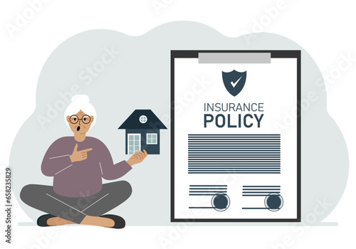 A woman holds in his hands at home next to a large insurance contract. Home and real estate insurance concept.
