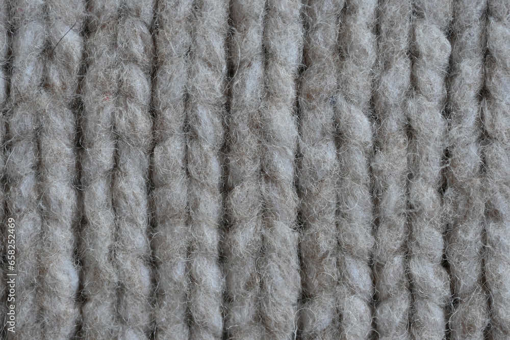 Large brown texture of face fabric as a background, knitted texture of sweater as a background