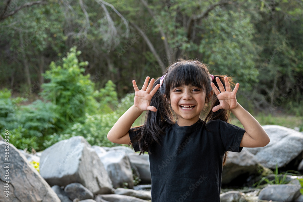 Sweet little girl super happy to be on vacation in a natural environment. Sweet little girl super happy to be on vacation in a natural environment.
