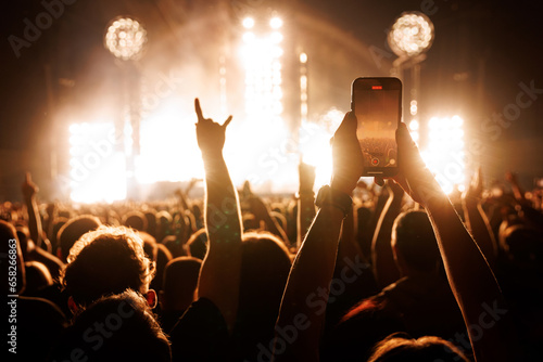 People Taking Photos At A Music Concert With Smartphones.