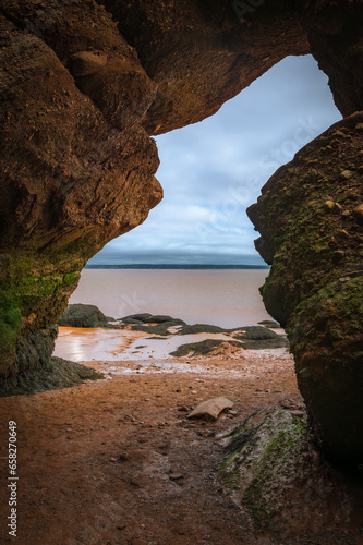 Cave entrance facing Fundy Bay, low tide, Hopewell Rocks, New Brunswick, Canada