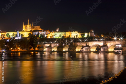 Prague castle and Charles bridge by night with star lights