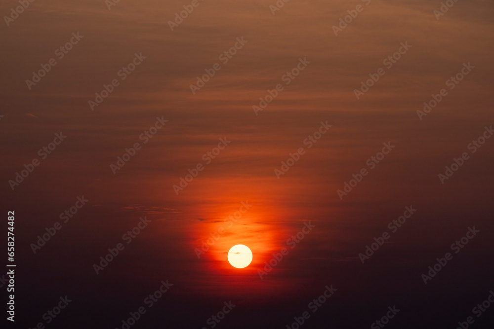 Orange glowing sun over Mamoré River near Exaltación in the lowlands of Bolivia, Beni department; Traveling South America Orange glowing sun over Mamoré River near Exaltación in the lowlands of Bolivia, Beni department; Traveling South America