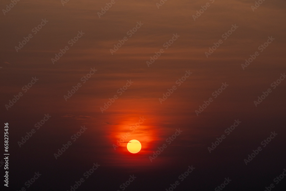 Orange glowing sun over Mamoré River near Exaltación in the lowlands of Bolivia, Beni department; Traveling South America Orange glowing sun over Mamoré River near Exaltación in the lowlands of Bolivia, Beni department; Traveling South America