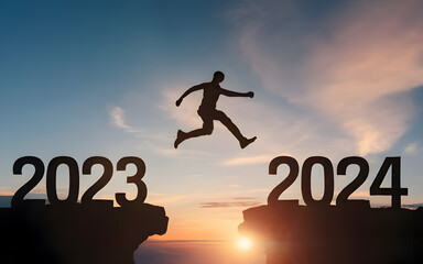 Happy new year 2024, Silhouette Man jumping from 2023 cliff to 2024 cliff on sky background.  Сoncept of moving from year to year. New Year's concept.