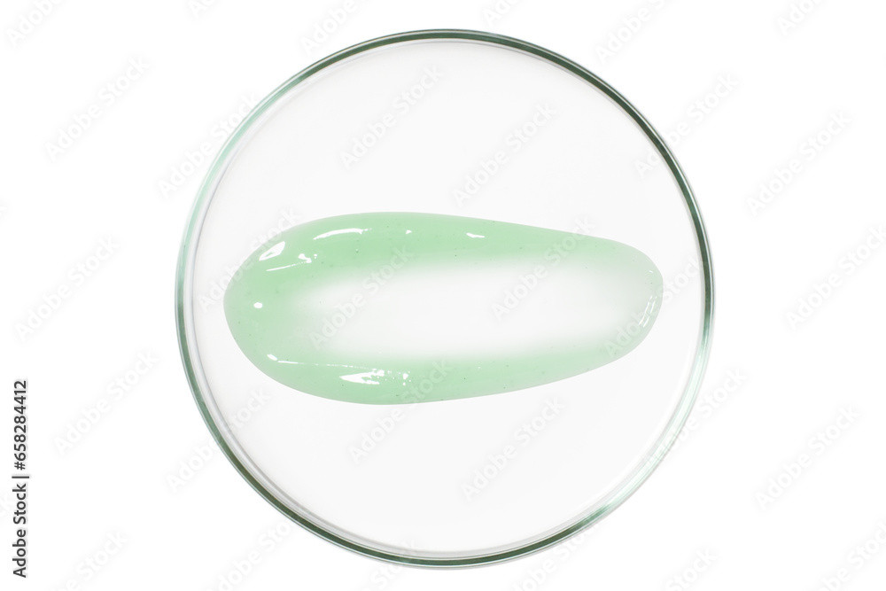 Petri dish isolated on empty background. A smear of green gel, serum in a Petri dish. Petri dish isolated on empty background. A smear of green gel, serum in a Petri dish.