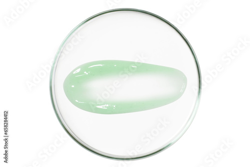 Petri dish isolated on empty background. A smear of green gel  serum in a Petri dish.