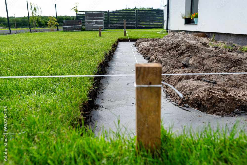 Foundation footings poured in a ditch in the yard, building a terrace in the backyard. Foundation footings poured in a ditch in the yard, building a terrace in the backyard.