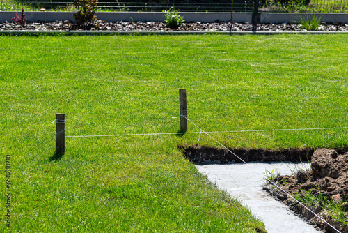 Принти на полотні Foundation footings poured in a ditch in the yard, building a terrace in the backyard