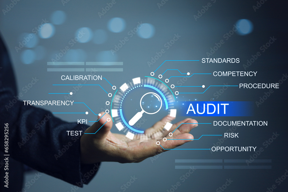 Auditor holding magnifying glass to audit factory assessment every year to ensure activities are conform to correct way against law and plan to meet the quality KPI target ISO standard