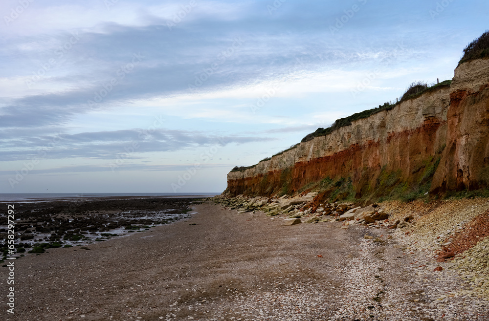 The colourful Hunstanton cliffs of white chalk, red chalk and orange sandstone, Norfolk, England