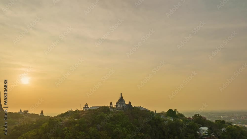 .aerial hyper lapse view beautiful golden sunrise the palace in Phetchaburi city on hilltop..A beautiful palace built on top of a hill is a famous landmark on the hilltop of Phetchaburi province.. .aerial hyper lapse view beautiful golden sunrise the palace in Phetchaburi city on hilltop..A beautiful palace built on top of a hill is a famous landmark on the hilltop of Phetchaburi province..