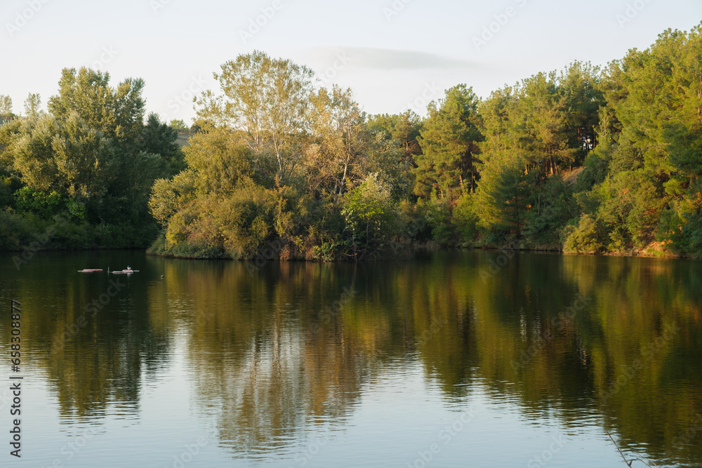 Beautiful autumn scenery. Scenic evening view of Lake and autumn forest. Colorful autumn scene of Greece, Europe. Beauty of nature concept background Beautiful autumn scenery. Scenic evening view of Lake and autumn forest. Colorful autumn scene of Greece, Europe. Beauty of nature concept background