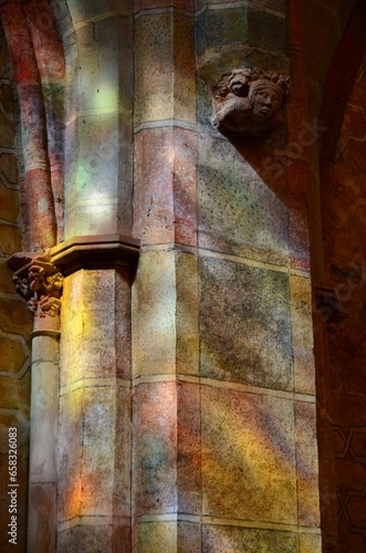 Reflection of a stained glass window on the wall of the Church of the Jacobins in Toulouse, France