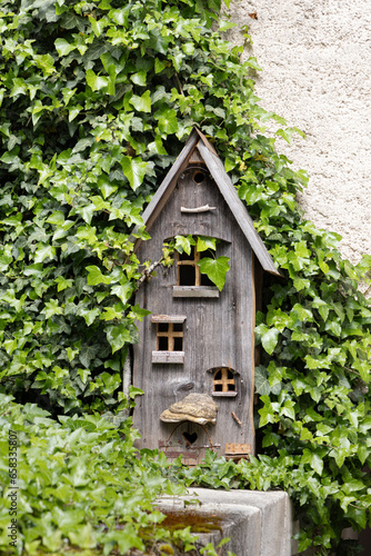 Beautiful little wooden gnome house in village Saint-Ursanne in canton Jura destrict Porrentruy in Switserland photo