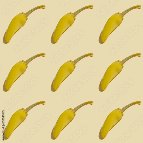 Seamless pattern with pickled hot pepper on beige background. photo