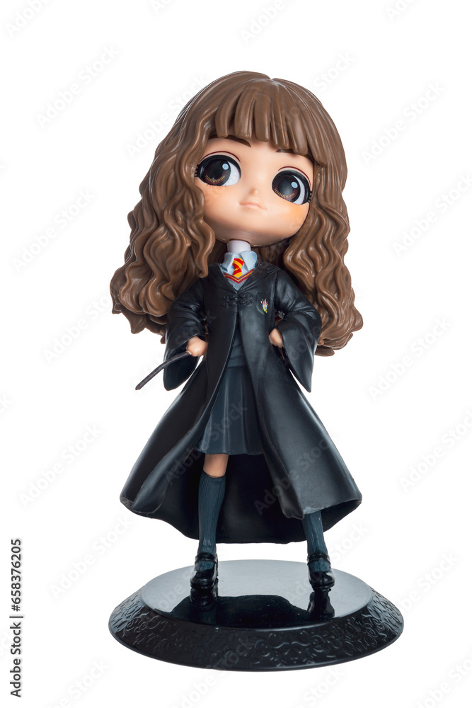 Fototapeta premium Figures of children wizards from books and films about Harry Potter isolated on a white background close-up, Hermione Granger