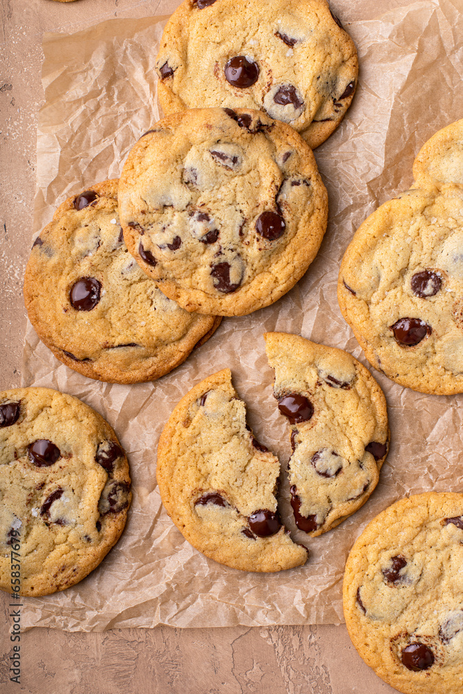 Chocolate chip cookies freshly baked on parchment paper